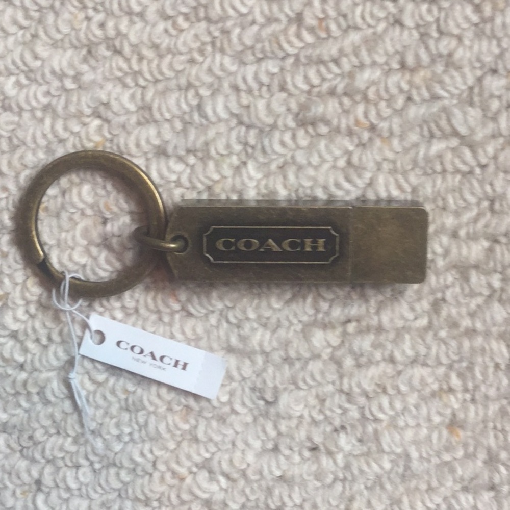 Coach brass flash drive